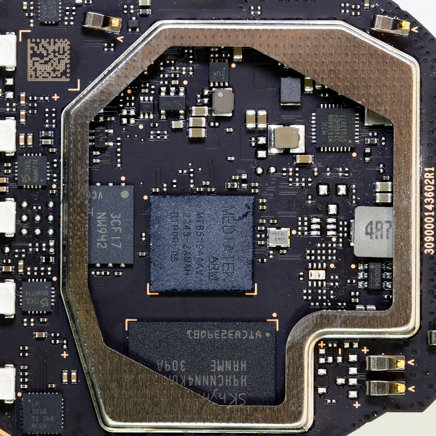 Metal shielding removed showing the main processor and ram and storage chips
