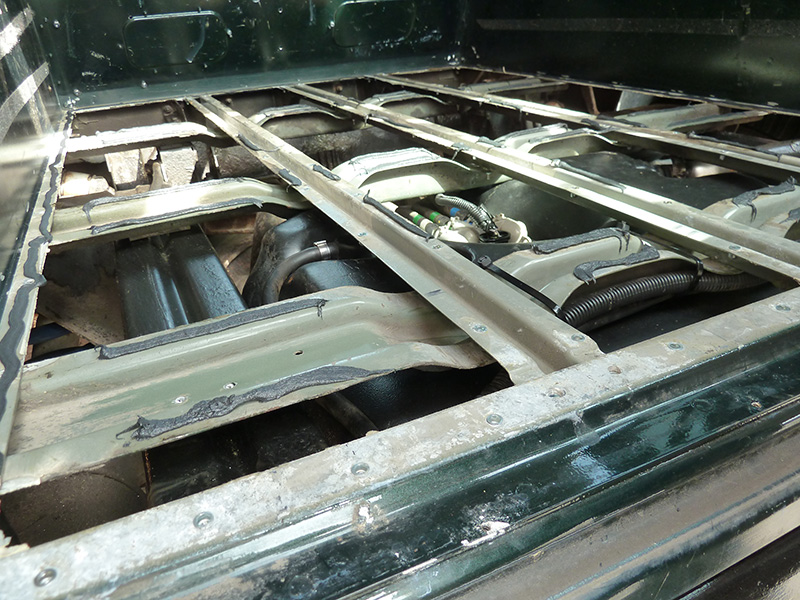 Putting sealant around the edges and on the floor supports