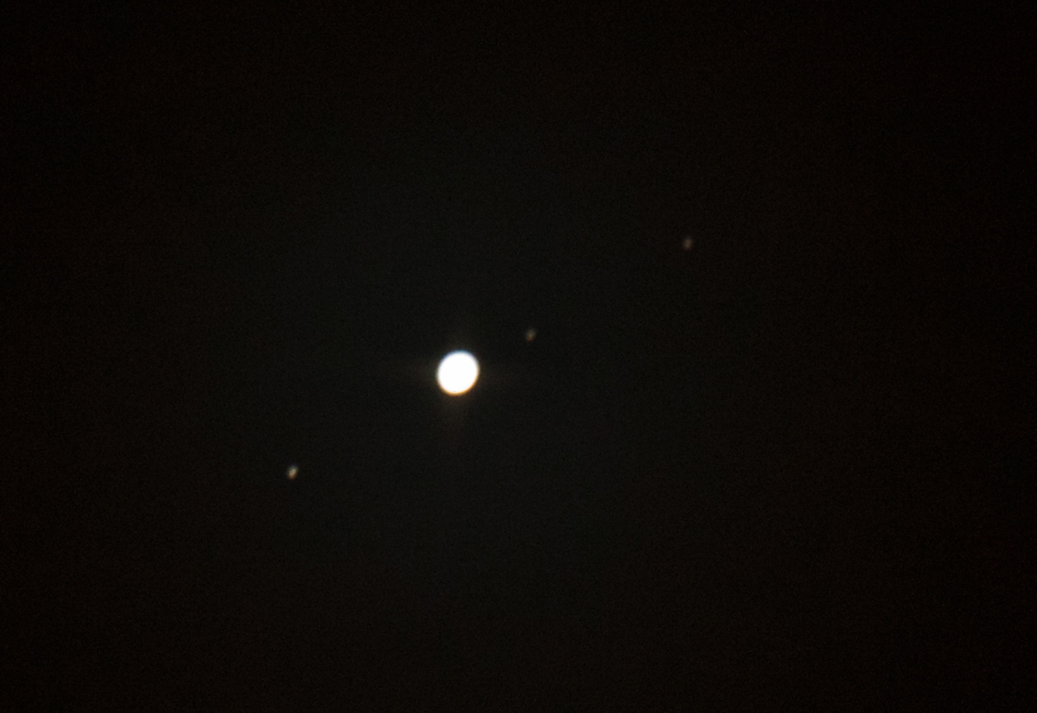 Photo of Jupiter and three moons