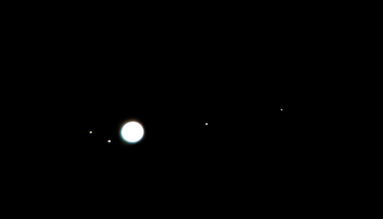 Photo of Jupiter and four moons