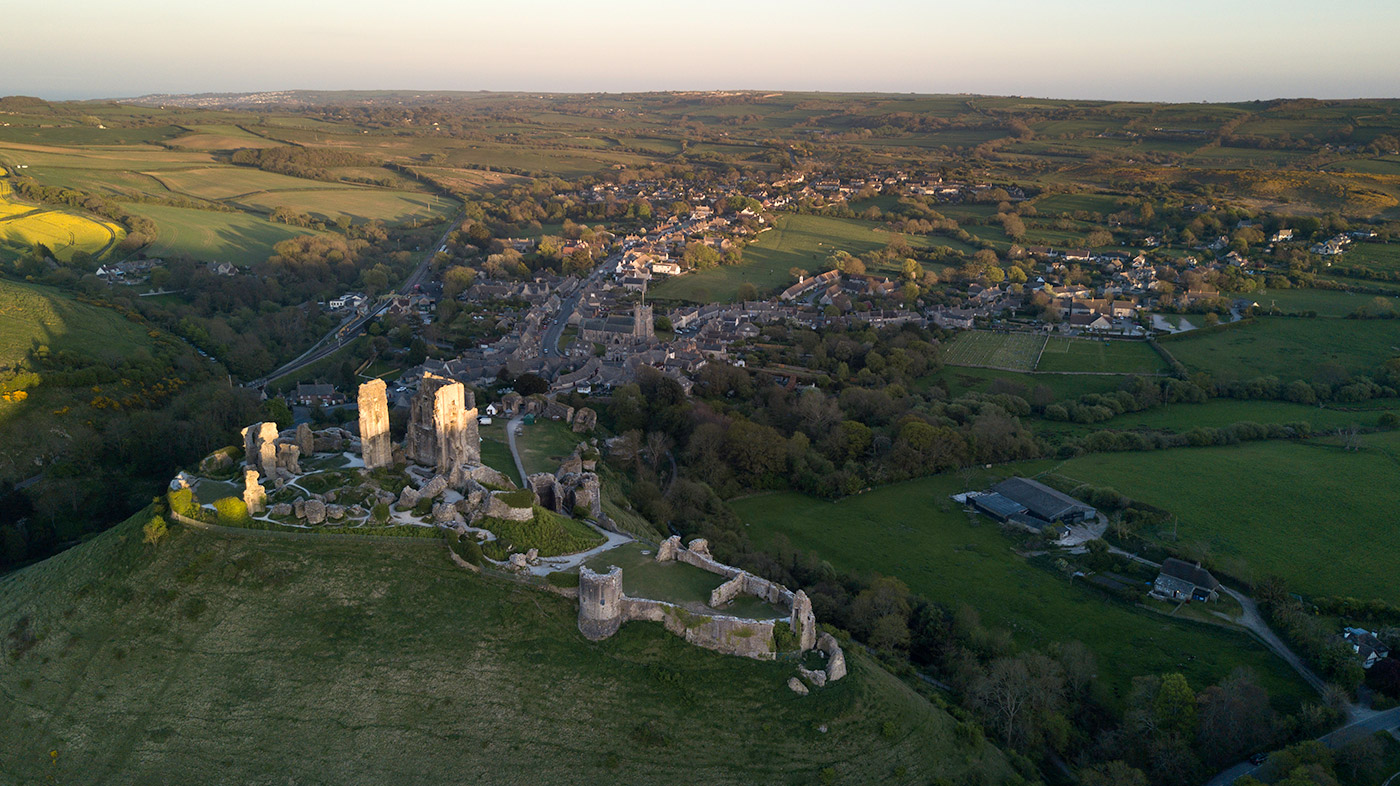 Photo of Sun setting over Corfe Castle, looking along the village