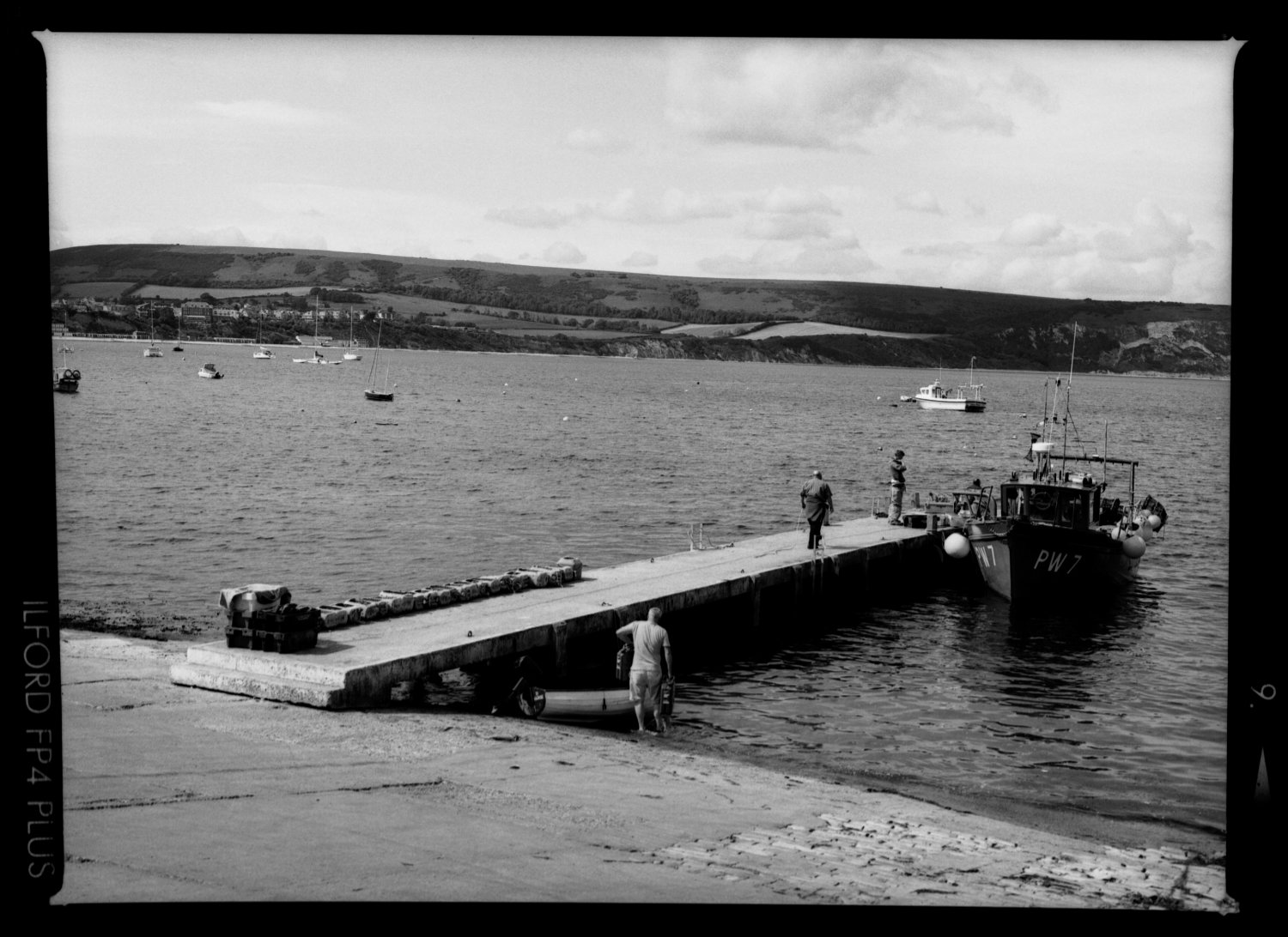 Photo of fishermen unloading catch